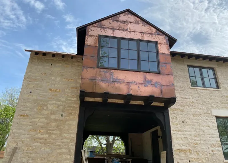 Copper metal panel facade on a stone building for Roof Repair in Plant City