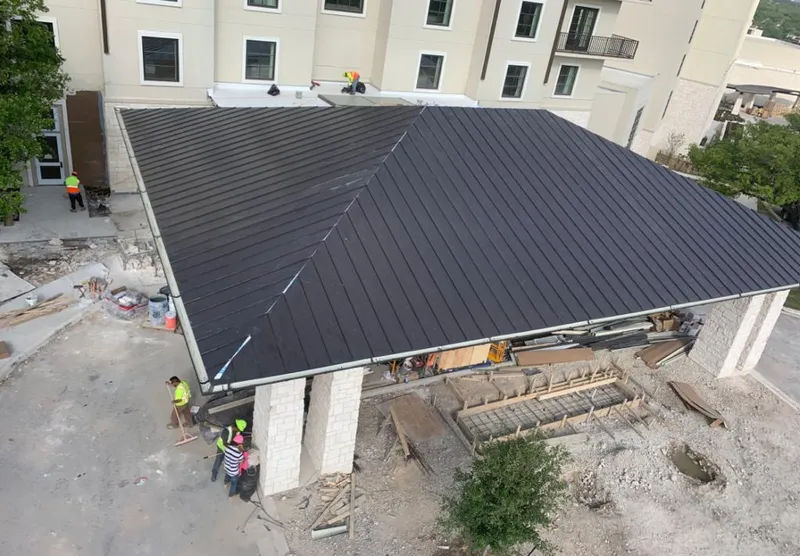 Metal roofing installation team working on a commercial building in Plant City