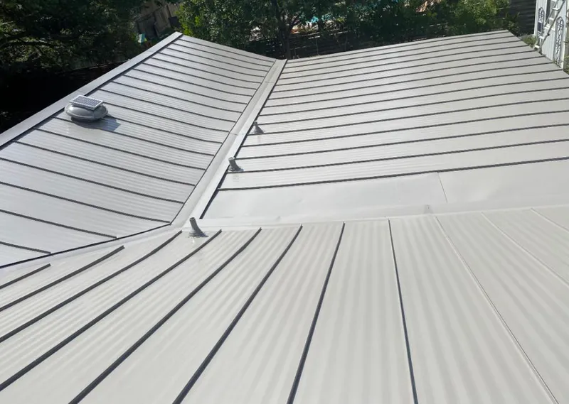 Solar attic fan installed on a metal roof for Roof Ventilation in Plant City